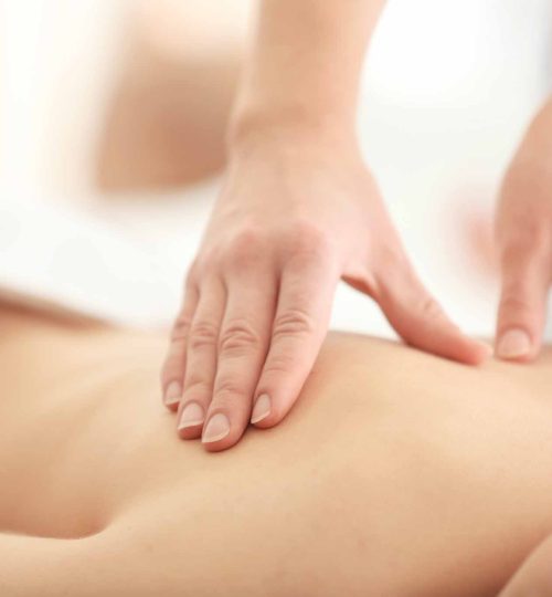 Young woman having massage in spa salon